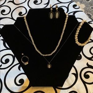 2 necklaces, pair of earrings 1 bracelet & a ring.